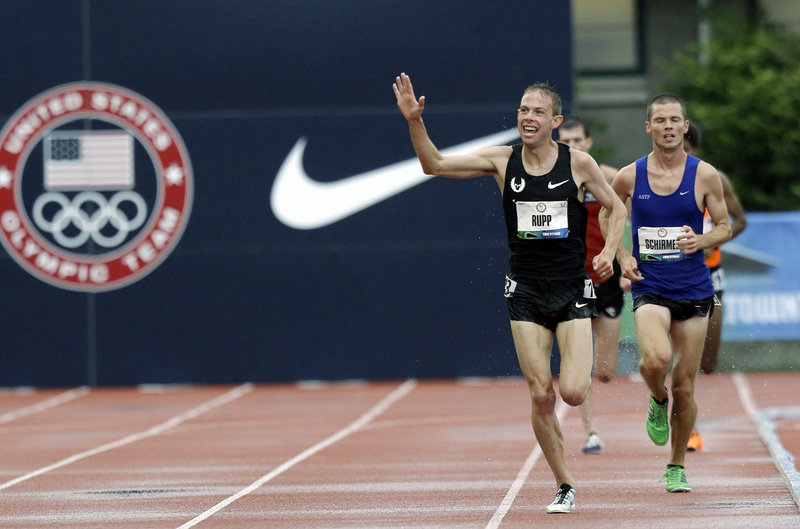 Galen Rupp waves to the crowd as he approaches the finish line of the 10,000 meters at the U.S. Olympic track and field trials Friday in Eugene, Ore. Rupp, a 2008 Olympian, won the race in 27 minutes, 25.33 seconds.