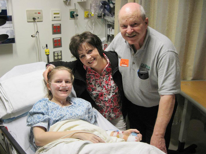 Ashley Drew, 25, of Scarborough poses with her parents, Joy and Tom Drew, just before undergoing a double lung transplant on June 8. Drew is insured on her mother’s plan thanks to provisions in the Affordable Care Act.
