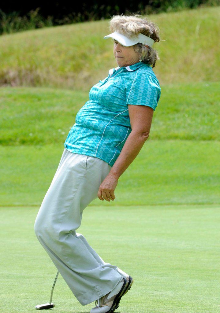 Hollis Stacy tries a little body language on a putt for birdie at the sixth hole at Falmouth Country Club. She finished at 3-over 75.