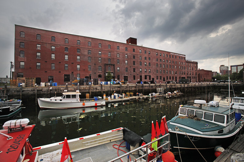 The Merrill’s Wharf building is among those on the Portland waterfront that are in need of tenants. The city’s new waterfront zoning rules allow up to 45 percent of the ground floor to be occupied by non-marine users.