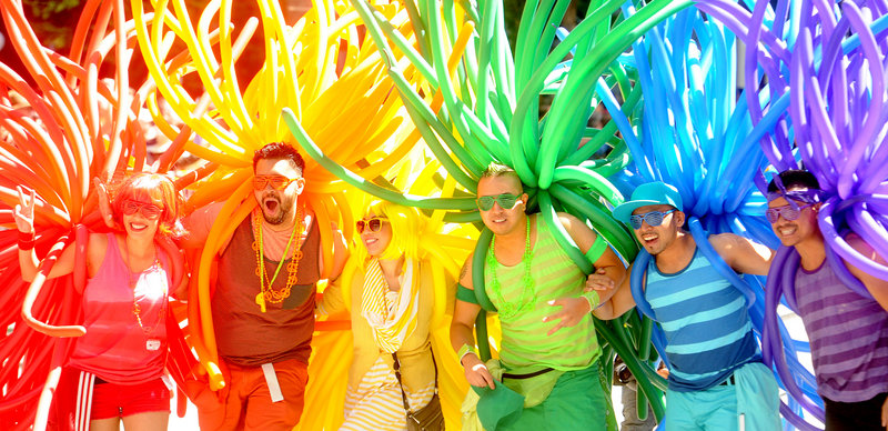 Revelers with balloons create a human rainbow during San Francisco’s 42nd annual Gay Pride Parade on Sunday.