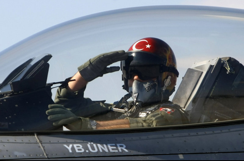 A Turkish pilot salutes before takeoff at an air base in Konya, Turkey, in 2010. Wreckage of a Turkish plane was found in the Mediterranean Sea, but the two pilots are still missing.