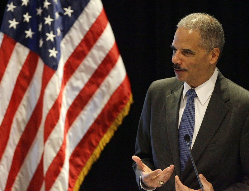 Attorney General Eric Holder speaks in Boston on Tuesday. The White House is defending him against a move in the House to hold him in contempt.