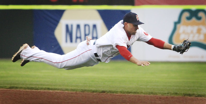 Second baseman Ryan Dent of the Portland Sea Dogs stretches to knock down a grounder in the third inning Tuesday night, but doesn’t make the throw to first during a 5-3 loss to New Hampshire in 13 innings at Hadlock Field.