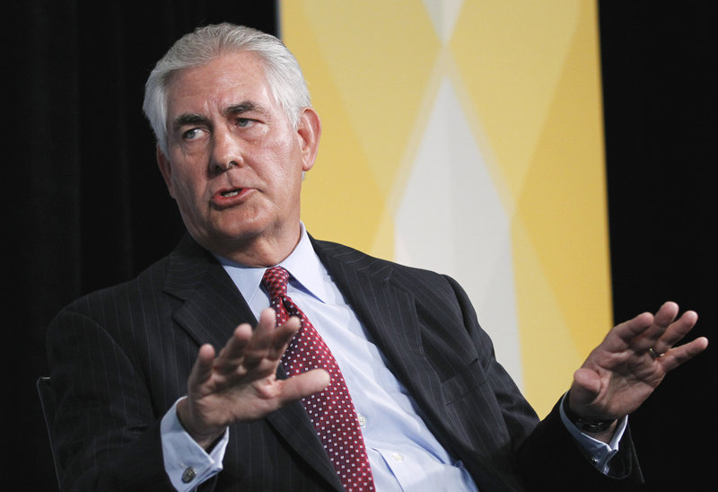 ExxonMobil CEO Rex Tillerson addresses a forum in Washington in 2011. On Wednesday he admitted that global temperatures are rising, but questioned the ability of climate models to predict the magnitude of the impact.