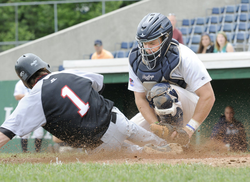 Matt Verrier, the catcher making the tag for the Old Orchard Beach Raging Tide, is one of the local players spending his summer playing baseball. Verrier, who plays at the University of Southern Maine, in high school helped Oxford Hills win a state championship.