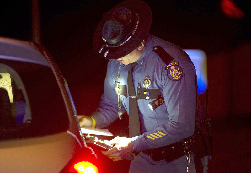 A state trooper makes a traffic stop on I-295 last year. Cutbacks have increased demands on law enforcement.