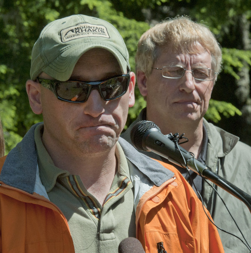 Aaron Hall, left, and Carter Hall speak to the news media at Longmire in Mount Rainier National Park about climbing ranger Nick Hall. Nick, who was brother to Aaron and son to Carter, fell to his death during a rescue operation last week.