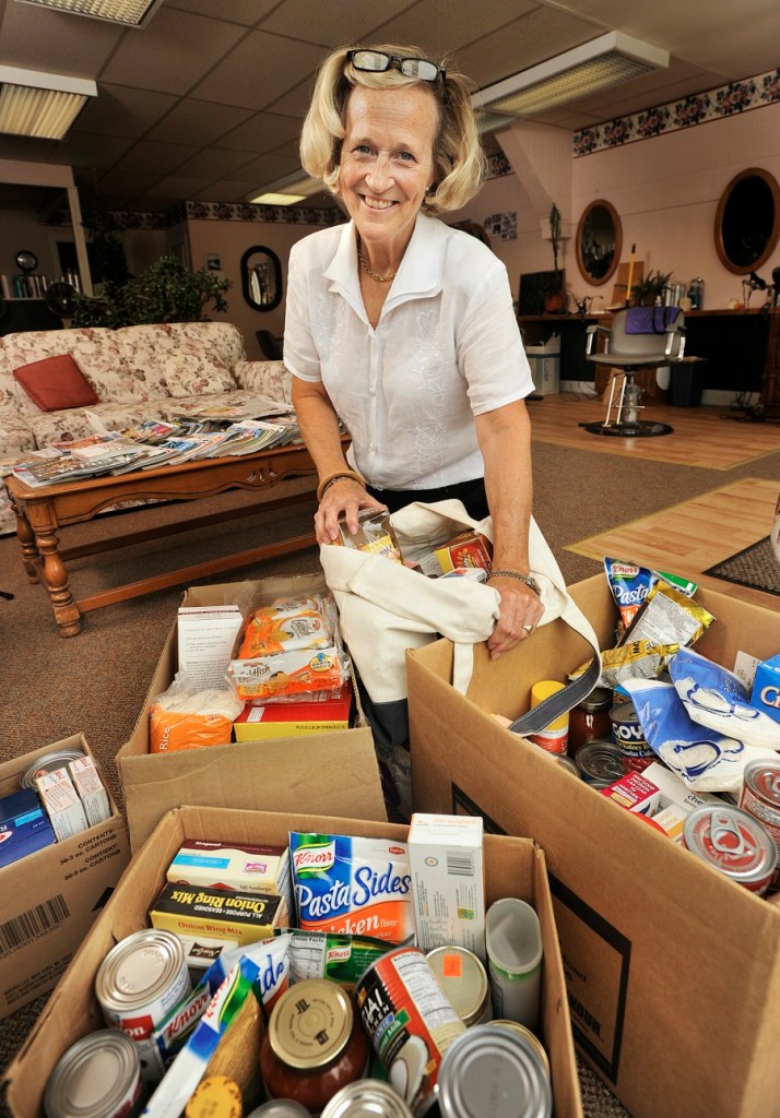Embodying "Freedom of Want", Deb Hopkins runs an ongoing food collection at her hair salon on Main Street in Yarmouth.