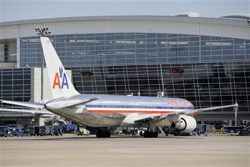 This June 29, 2011 file photo, shows an American Airlines aircraft at a Terminal D gate at Dallas-Fort Worth International Airport, in Grapevine, Texas. A new industry forecast about a possible pilot shortage in the U.S. is a safety concern.