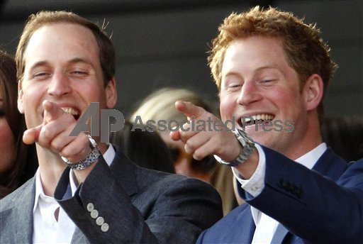 Prince William with his brother, Prince Harry, right, pointing at something as they attend the Diamond Jubilee concert in London last month. William and Harry will both be at Friday's opening ceremony for the London Olympics, along with Prince Charles, his wife, Camilla, and William's wife, Kate.
