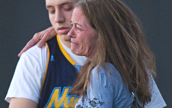 Jacob Stevens, 18, hugged his mother, Tammi Stevens, after being interviewed by police outside Gateway High School in Denver.