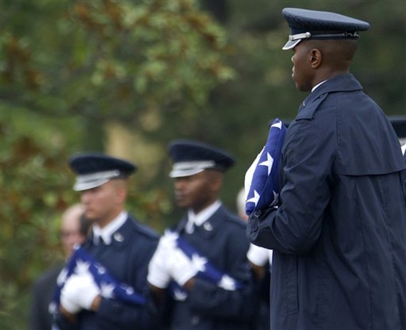 Members of the Air Force Honor Guard hold American flags to be presented to family members during a burial service for Air Force Col. Joseph Christiano, Col. Derrell B. Jeffords, Lt. Col. Dennis L. Eilers, Chieft Master Sgt. William K. Colwell, Chief Master Sgt. Arden K. Hassenger and Chief Master Sgt. Larry C. Thornton, Monday, July 9, 2012, at Arlington National Cemetery Arlington, Va. It was Christmas Eve 1965 when the Air Force plane nicknamed "Spooky" took off from Vietnam for a combat mission. The crew sent out a "mayday" signal while flying over Laos, and after that, all contact was lost. Two days of searches turned up nothing. (AP Photo/Haraz N. Ghanbari)