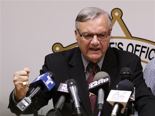 A defiant Maricopa County Sheriff Joe Arpaio pounds his fist on the podium as he answers questions regarding the Department of Justice announcing a federal civil lawsuit against him and his department, during a news conference in Phoenix on May 10, 2012.