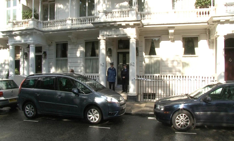 Police gather outside a house in Cadogan Place, Chelsea, after the body of Eva Rausing, one of the richest women in Britain, was found Tuesday.