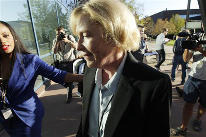 Carol Chambers, Arapahoe County District Attorney, arrives at the county courthouse today in Centennial, Colo., for the first court appearance of James E. Holmes.