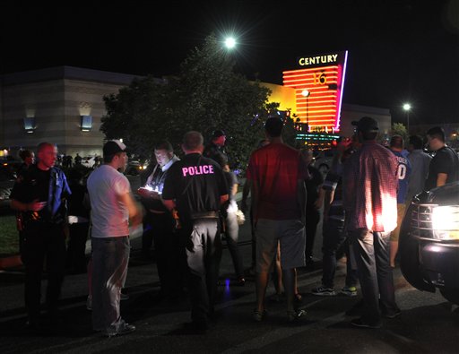 Police take witness statements outside the Century 16 movie theater in Aurora, Colo., following an early morning mass shooting.