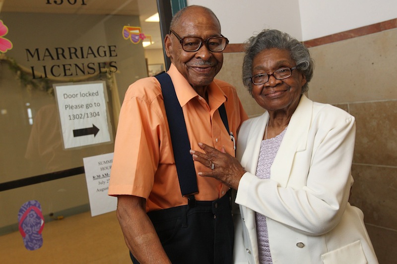 In a Monday, July 23, 2012 photo, Roland Davis of Colorado, left, and Lena Henderson of West Seneca, N.Y. pose for a photo at the Buffalo City Hall. DAvis and Henderson were divorced 50 years ago in Georgia. At 85, they are remarrying. They went to City Hall to get their marriage license,, for their August 4 wedding. (AP Photo/Buffalo News, Sharon Cantillon) (AP Photo/The Buffalo News)
