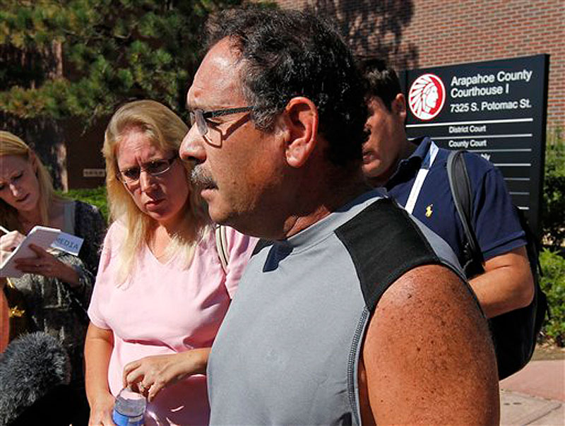 David Sanchez, whose son-in-law was critically wounded, speaks after a court appearance by shooting suspect James Holmes at the Arapahoe County Courthouse, Monday, July 23, 2012, in Centennial, Colo. Twelve people were killed and dozens were injured in the shooting attack early Friday at an Aurora, Colo., theater during a showing of the Batman movie, "The Dark Knight Rises." Sanchez's pregnant daughter escaped uninjured. (AP Photo/Alex Brandon)
