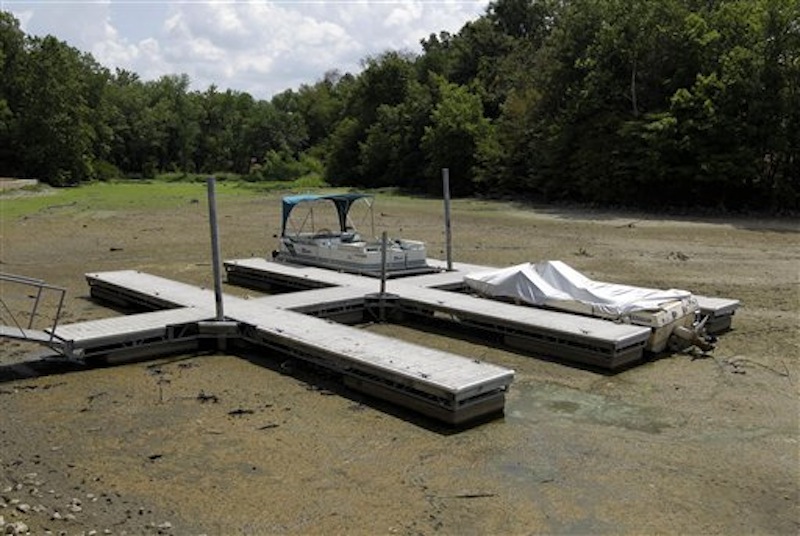 Boats sit on the bottom in a dry cove at Morse Reservoir in Noblesville, Ind., Monday, July 16, 2012. The reservoir is down nearly 6 feet from normal levels and being lowered 1 foot every five days to provide water for Indianapolis. (AP Photo/Michael Conroy)