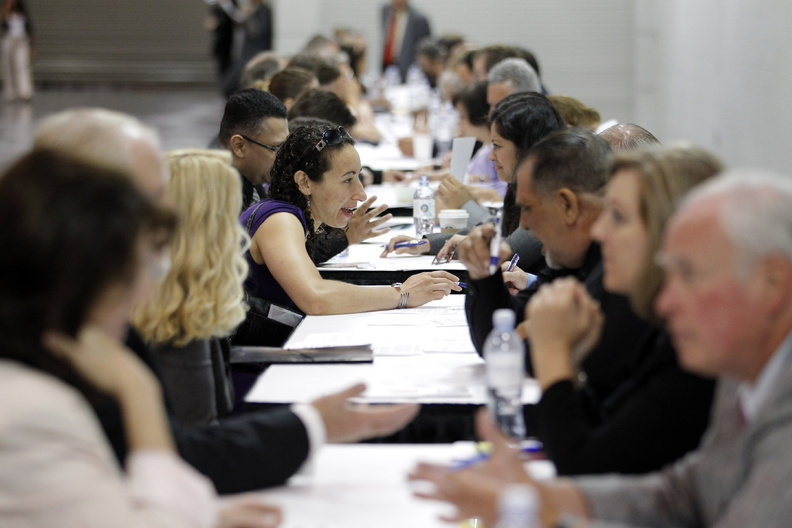 Job seekers have their resumes reviewed at a job fair expo in Anaheim, Calif., on June 13. U.S. employers added only 80,000 jobs in June, a third straight month of weak hiring that shows the economy is still struggling.