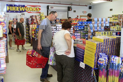 Customers fill up on 4th of July fireworks at the Hilltop Fireworks store, on Tuesday in Somersworth, N.H.