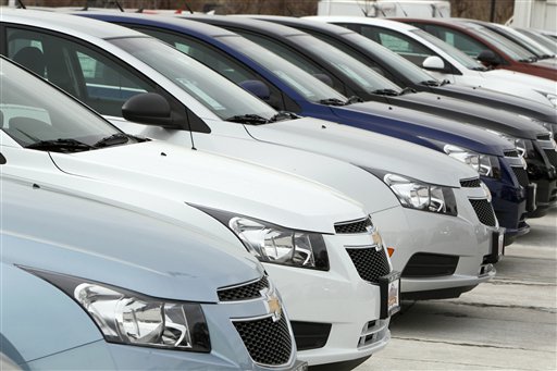 A line of 2012 Chevrolet Cruze sedans on display at a dealership in the south Denver suburb of Englewood, Colo.