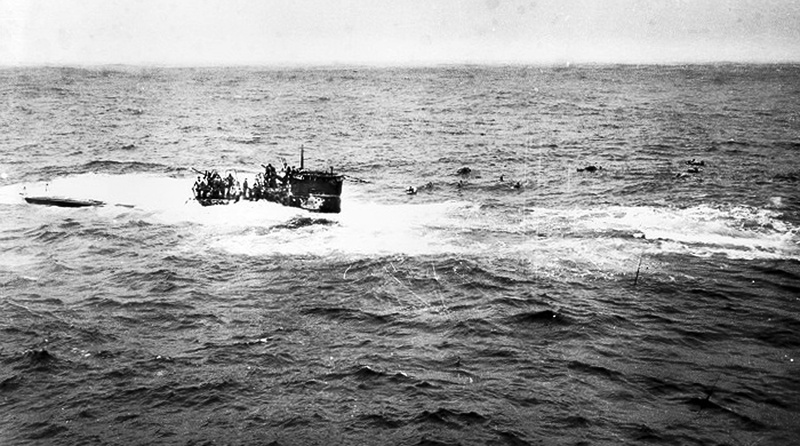 This April 16, 1944, photo shows crewmen of German submarine U-550 abandoning ship in the Atlantic Ocean after being depth charged by the USS Joyce, a destroyer in an Allied convoy that the submarine attacked.