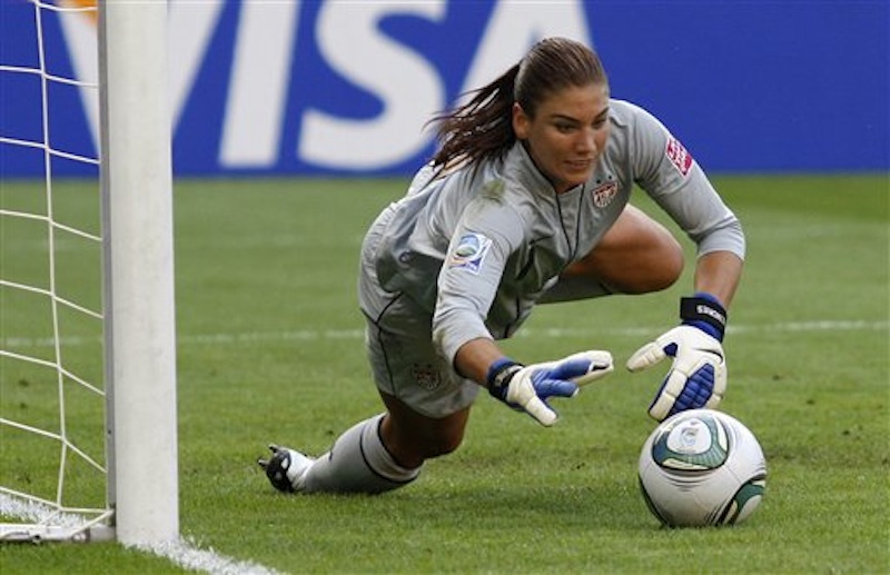 In this July 10, 2011, file photo, United States goalkeeper Hope Solo catches a ball during the quarterfinal match against Brazil at the Women's Soccer World Cup in Dresden, Germany. Solo received a public warning Monday, July 9, 2012, from the U.S. Anti-Doping Agency after she tested positive for the banned substance Canrenone in a urine test. Solo has accepted the warning and will still play for the United States in the Olympic tournament. (AP Photo/Petr David Josek, File)