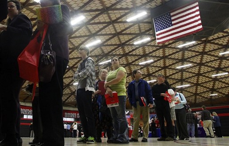 In this April 10, 2012, file photo, people wait in a line at a job fair in Gresham, Ore. The state releases its latest jobless figures, Tuesday, April 17, 2012. Employers in April posted the fewest job openings in five months, suggesting hiring will remain sluggish in the months ahead. The Labor Department said Tuesday, June 19, 2012 that job openings fell to a seasonally adjusted 3.4 million in April, down from 3.7 million in March. (AP Photo/Rick Bowmer, file)