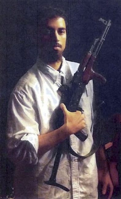 This section of an undated photo released by the U.S. Attorney's Office, which had been presented as a government exhibit at a 2011 hearing, shows Rezwan Ferdaus, of Ashland, Mass. Court documents filed Tuesday, July 10, 2012 said Ferdaus, who is charged with plotting to fly remote-controlled model planes packed with explosives into the Pentagon and U.S. Capitol, plans to plead guilty to two charges on July 20, 2012 in federal court in Boston. (AP Photo/U.S. Attorney's Office)