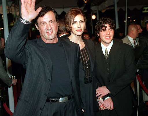 In this Dec. 5, 1996, file photo, Sylvester Stallone, left, star of the film "Daylight," arrives at the film's world premiere with Jennifer Flavin and his son Sage Stallone, who co-starred in the film, in Los Angeles. A publicist for Sylvester Stallone said Sage Stallone died Friday at the age of 36.