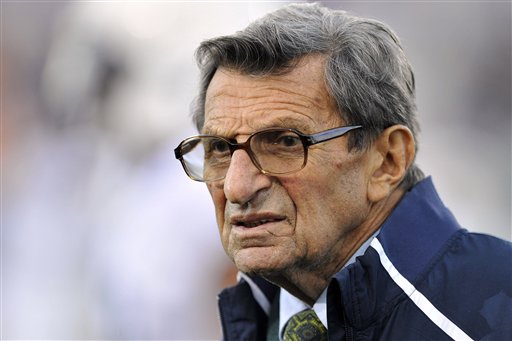 In this Oct. 22, 2011 file photo, Penn State coach Joe Paterno stands on the field before an NCAA college football game against Northwestern, in Evanston, Ill. Paterno's family has blasted a report – which says Paterno helped cover up Jerry Sandusky's child sex abuse — as opinions masquerading as facts. (AP Photo/Jim Prisching, File)