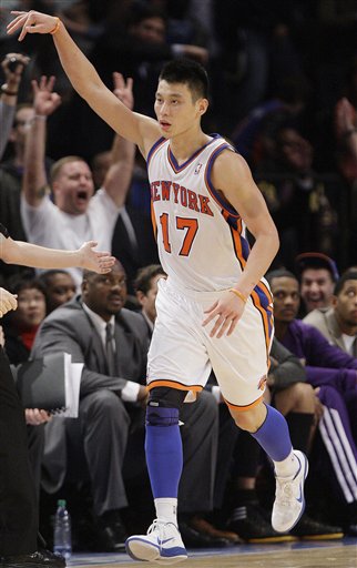 The New York Knicks' Jeremy Lin reacts after making a 3-point basket during the second half of an NBA basketball game against the Los Angeles Lakers on Feb. 10 in New York. He averaged 14.6 points and 6.2 assists in 35 games before his season ended because of torn cartilage in his left knee.