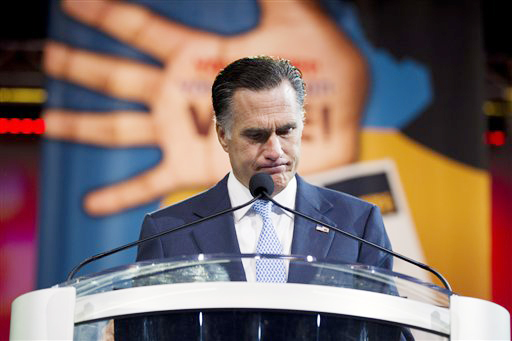 Republican presidential candidate, former Massachusetts Gov. Mitt Romney pauses during a speech before the NAACP annual convention today in Houston.