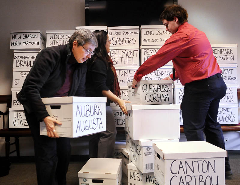 Volunteers stack boxes of signatures to put a same-sex marriage referendum on the ballot. Secretary of State Charlie Summers released the final wording of the November ballot question this week.