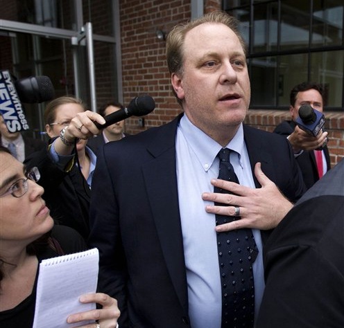 In this Wednesday, May 16, 2012 file photo, former Boston Red Sox pitcher Curt Schilling, center, is followed by members of the media as he departs the Rhode Island Economic Development Corporation headquarters, in Providence, R.I. The failed video game company founded by Schilling is in federal bankruptcy court in Delaware, as work begins to sort out what can be salvaged from a company that says it owes more than $270 million. (AP Photo/Steven Senne, File)