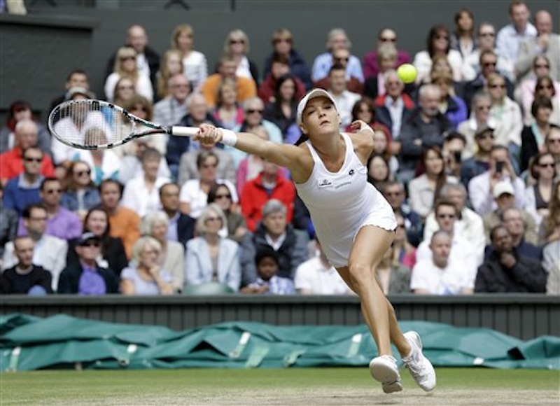 Agnieszka Radwanska of Poland plays a shot to Serena Williams of the United States during the women's final match at the All England Lawn Tennis Championships at Wimbledon, England, Saturday, July 7, 2012. (AP Photo/Alastair Grant)