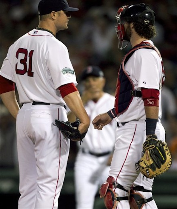 Boston Red Sox pitcher Jon Lester, left, talks with his catcher as manager Bobby Valentine, center, approaches the mound to relieve Lester from the game in the fifth inning Sunday against the New York Yankees. The last-place Red Sox are hoping for better health in second half of the season. (AP Photo/Steven Senne)