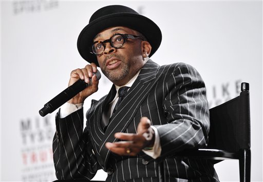 This June 18, 2012 file photo shows director Spike Lee talking about his Broadway directorial debut "Mike Tyson: Undisputed Truth." Lee is working on a yet untitled documentary about Michael Jackson's "Bad" album. Lee's documentary will be part a flood of material to celebrate the 25th anniversary of the "Bad" album, Jackson's follow-up to "Thriller" which included hits like the title track, "Smooth Criminal," "The Way You Make Me Feel" and more. (Photo by Evan Agostini/Invision/AP, file) Half Length