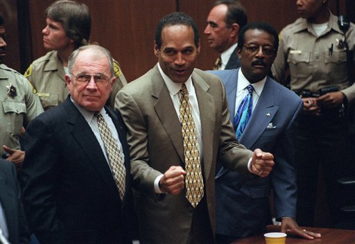 This Oct. 3, 1995 file photo shows O.J. Simpson, center, with defense attorneys F. Lee Bailey, left, and Johnnie Cochran after Simpson was found not guilty of murdering his ex-wife Nicole Brown Simpson and her friend Ron Goldman at the Criminal Courts Building in Los Angeles. Sony Electronics and the Nielsen television research company collaborated on a survey ranking TV's most memorable moments. Other TV events include, the Sept. 11 attacks in 2001, Hurricane Katrina in 2005, the Challenger space shuttle explosion in 1986 and the death of Osama bin Laden in 2011. (AP Photo/Myung J. Chun, file)