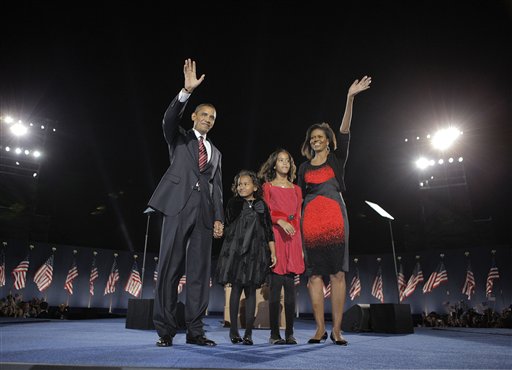 This Nov. 4, 2008 file photo shows President-elect Barack Obama, left, his wife Michelle Obama, right, and two daughters, Sasha, 7, and Malia, 10, second from right, as they wave at the election night rally in Chicago. Sony Electronics and the Nielsen television research company collaborated on a survey ranking TV's most memorable moments. Other TV events include, the Sept. 11 attacks in 2001, Hurricane Katrina in 2005, the O.J. Simpson murder trial verdict in 1995 and the death of Osama bin Laden in 2011. (AP Photo/Jae C. Hong, File)