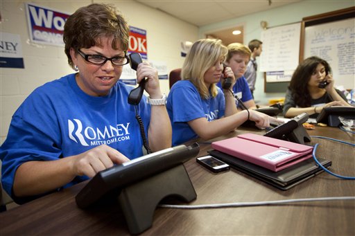 In this photo taken June 29, 2012, Karen Chew, left, of Washington, and fellow volunteers make phone calls for the Romney campaign at a Romney Victory Office in Fairfaix, Va. where she says she puts in about a dozen hours a week but wishes she could put in more time. Call them passionate, idealistic, earnest, even a tad naive: The volunteers helping to power the Obama and Romney campaigns are outliers at a time when polls show record low public satisfaction with government and a growing belief that Washington isn�t on their side. While motivated by opposing goals, the Obama and Romney volunteers share at least one key trait: an abiding faith in the political process and a belief that it still matters who occupies the White House. (AP Photo/Jacquelyn Martin)