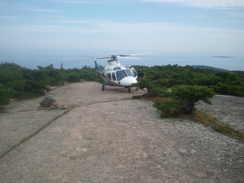 A helicopter from LifeFlight of Maine landed on a sloped, open ledge on Champlain Mountain in Acadia National Park in order to evacuate an injured hiker Saturday.