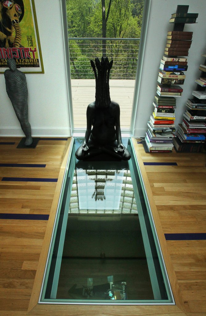 An upstairs view of the structural glass floor that interior designer Steve Levey installed in an Akron, Ohio, home.