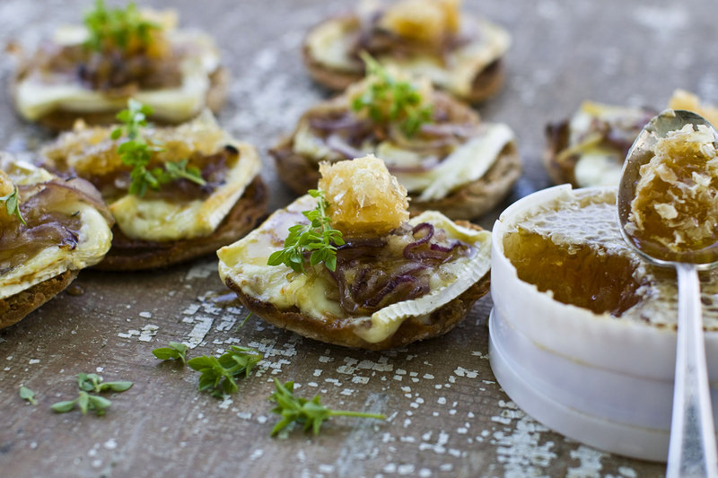 Honeycomb and brie combine deliciously on easy English muffin pizzas. Tubs of unbroken honeycomb increasingly are available at farmers markets and grocery stores, and its texture and taste enliven many dishes.