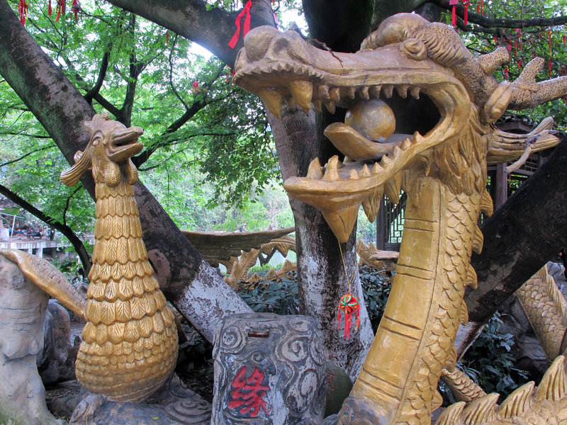 A serpent greets visitors to a “wishing tree” at Elephant Trunk Hill in Guilin.
