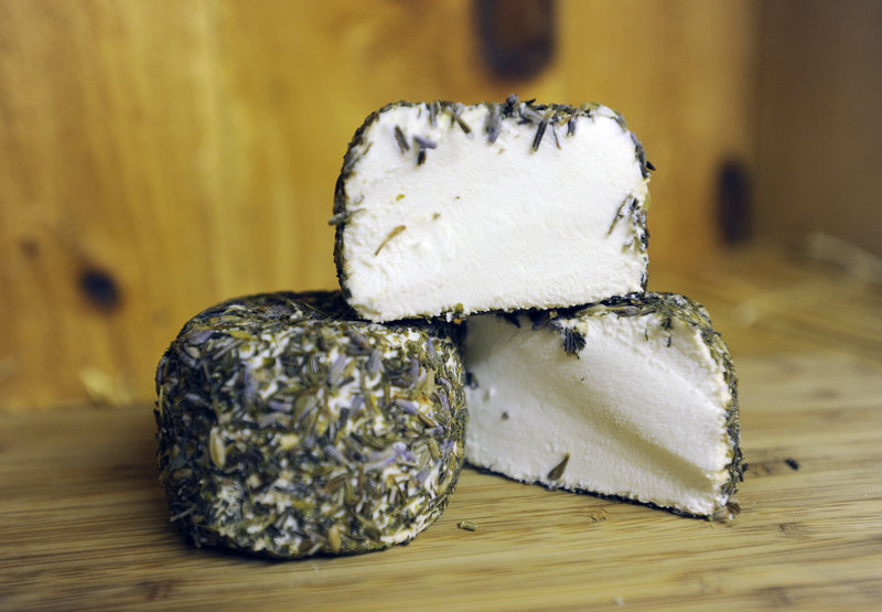 Kennebec Cheesery’s goat’s milk cheese can be enjoyed plain or rolled in herbes de Provence, as shown here.
