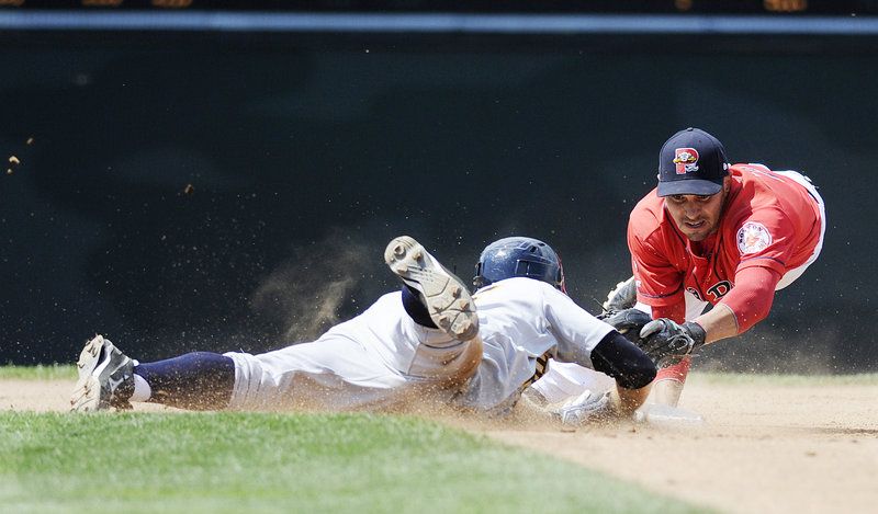 Portland’s Ryan Dent dives to second base to try and tag Trenton’s David Adams. Adams was safe, though, and the Thunder went on to defeat the Sea Dogs in the 11th.