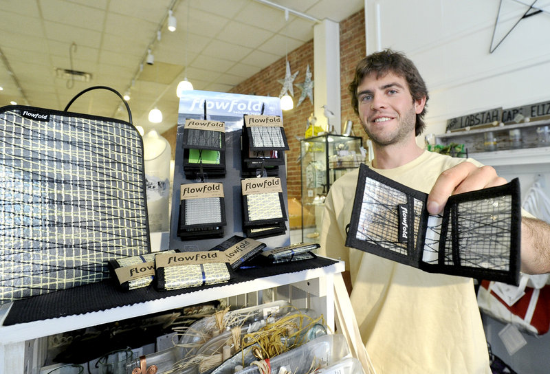 Charles Friedman, 23, is founder of FlowFold wallets and tablet cases, which he displays at Lisa-Marie’s Made in Maine store in Portland in this July 2012 file photo. 